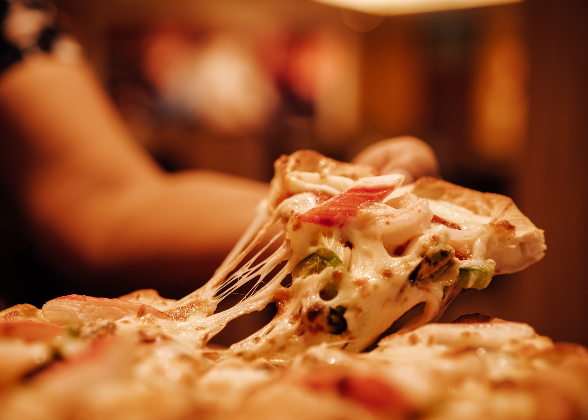 Slice of hot pizza cheese lunch or dinner crust seafood meat top
